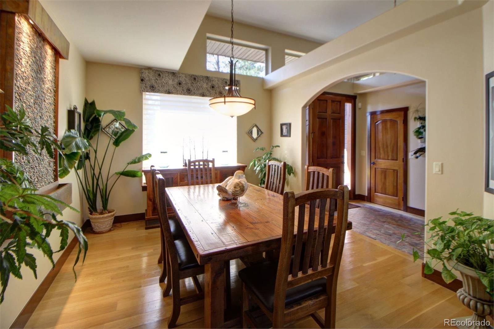 3095 South Piney Ridge Road Evergreen, CO 80439 - Photo 5 of 30 a view of a dining room with furniture and window