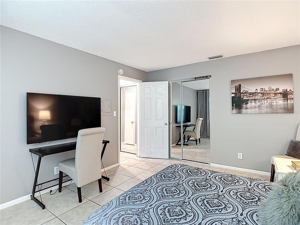 137 Southeast Jefferson Circle North St. Petersburg, FL 33703 - Photo 19 of 24 a bedroom with furniture and a window