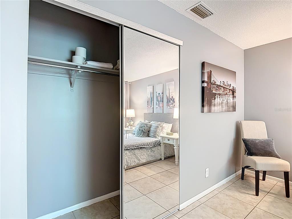 137 Southeast Jefferson Circle North St. Petersburg, FL 33703 - Photo 20 of 24 a view of a hallway to a livingroom with furniture and windows
