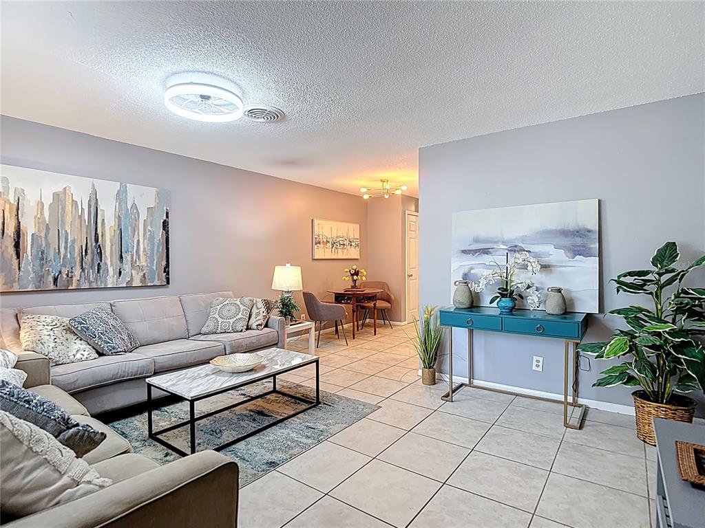 137 Southeast Jefferson Circle North St. Petersburg, FL 33703 - Photo 6 of 24 a living room with furniture and a potted plant