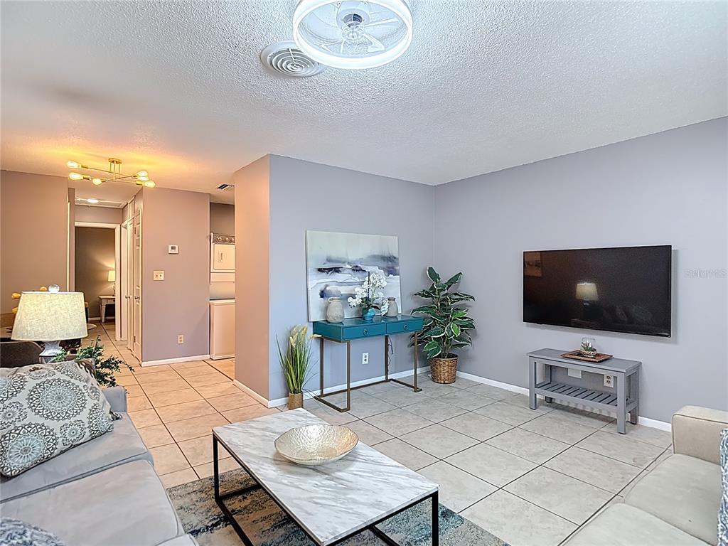137 Southeast Jefferson Circle North St. Petersburg, FL 33703 - Photo 9 of 24 a living room with furniture and a flat screen tv