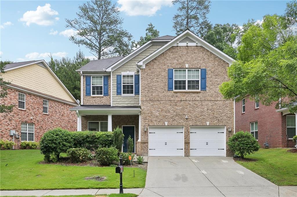 a front view of a house with a yard