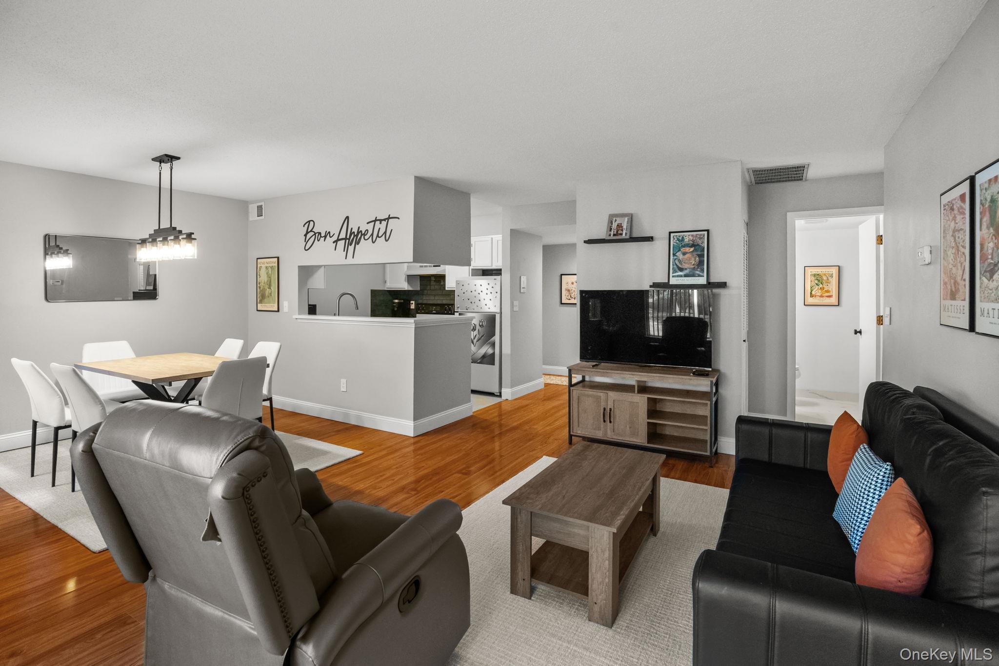 50 Bayberry Drive Peekskill, NY 10566 - Photo 2 of 38 a living room with furniture and a flat screen tv