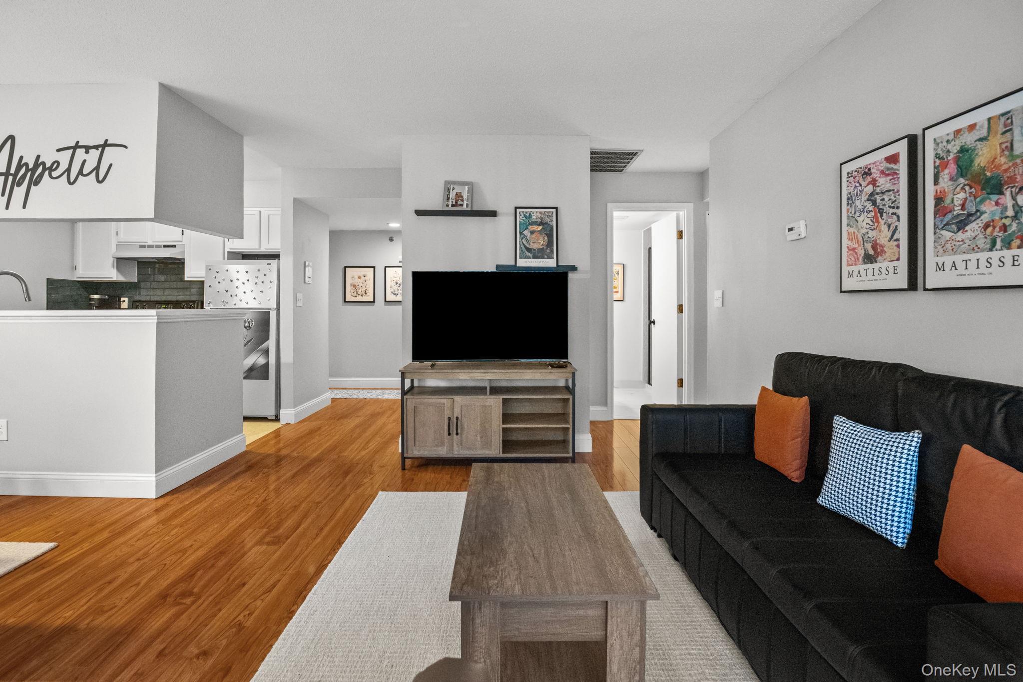 50 Bayberry Drive Peekskill, NY 10566 - Photo 3 of 38 a living room with furniture and a flat screen tv