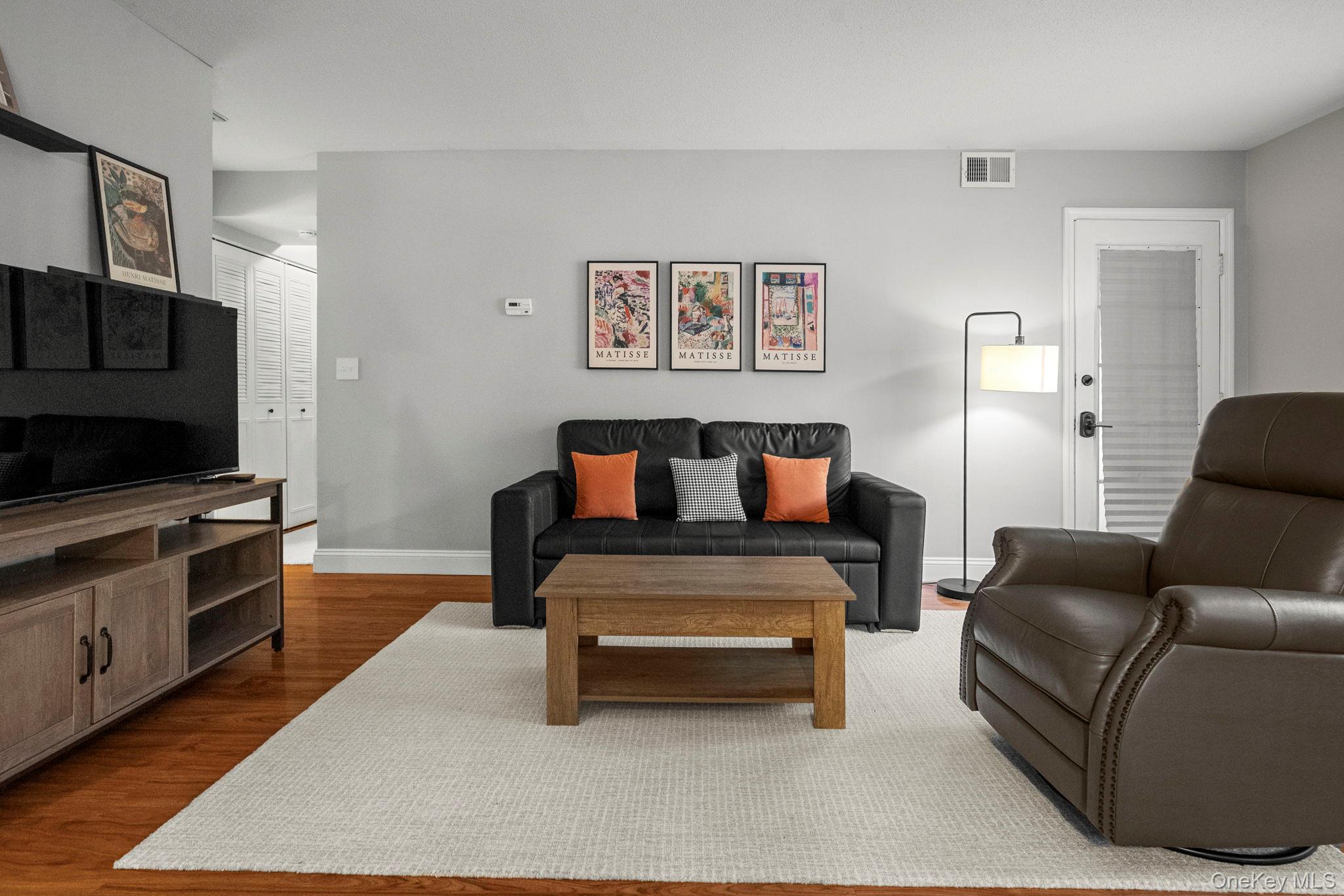 50 Bayberry Drive Peekskill, NY 10566 - Photo 4 of 38 a living room with furniture and a flat screen tv