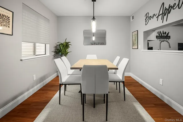 a dining room with furniture and window