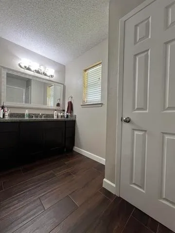 a bathroom with a toilet and a shower curtain