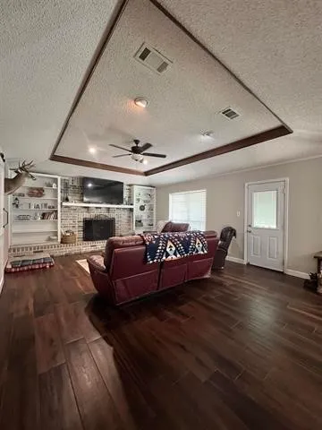a bed room with furniture and a ceiling fan