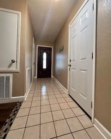 a view of a livingroom with wooden floor and a window