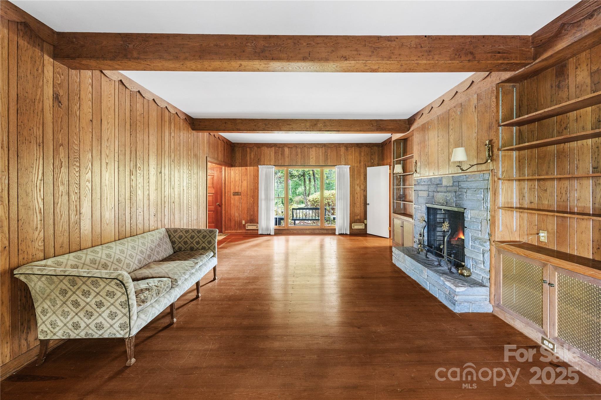 603 Green Hills Road Mill Spring, NC 28756 - Photo 11 of 47 a living room with furniture and a fireplace