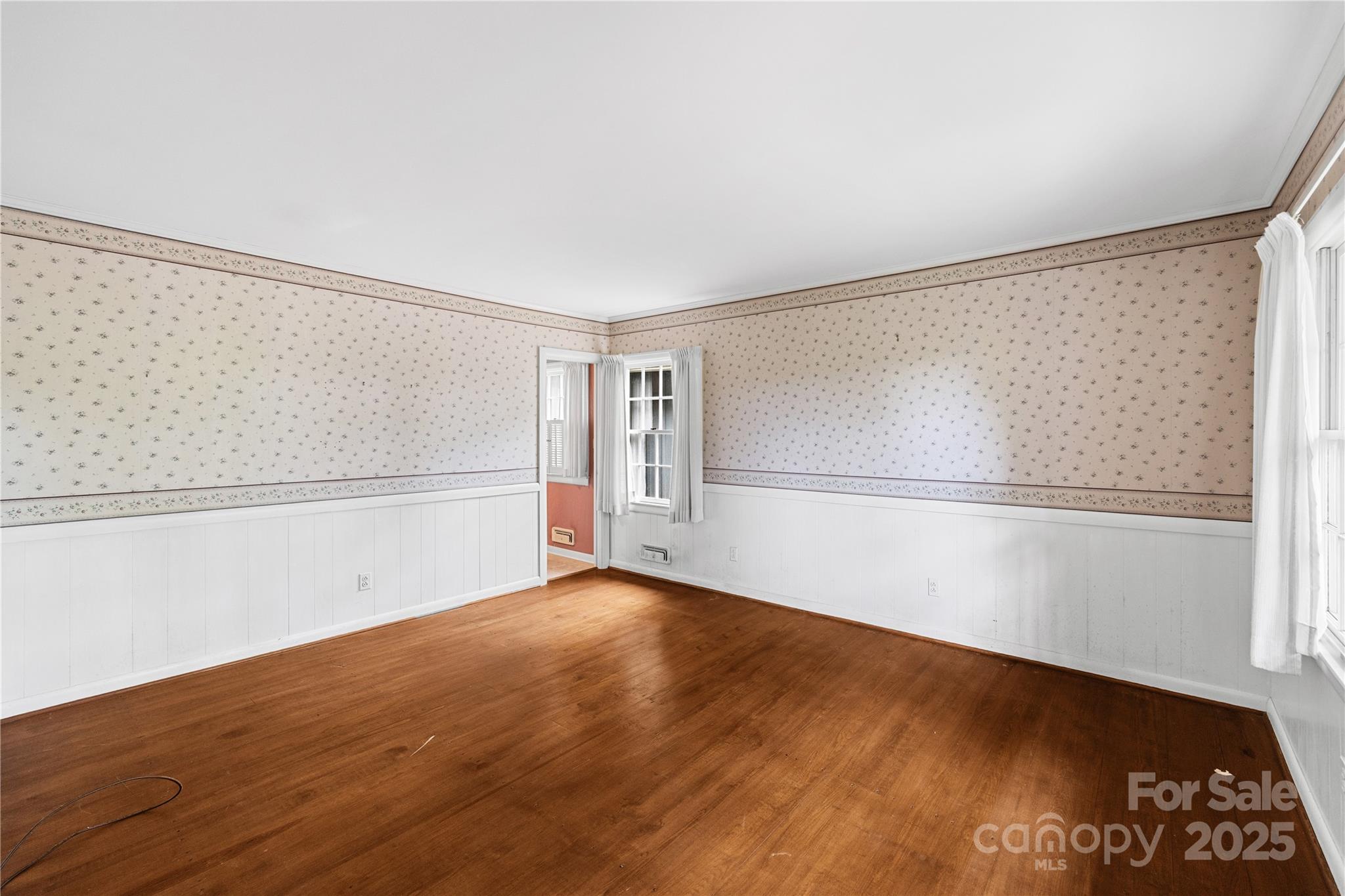 603 Green Hills Road Mill Spring, NC 28756 - Photo 12 of 47 a view of an empty room with wooden floor