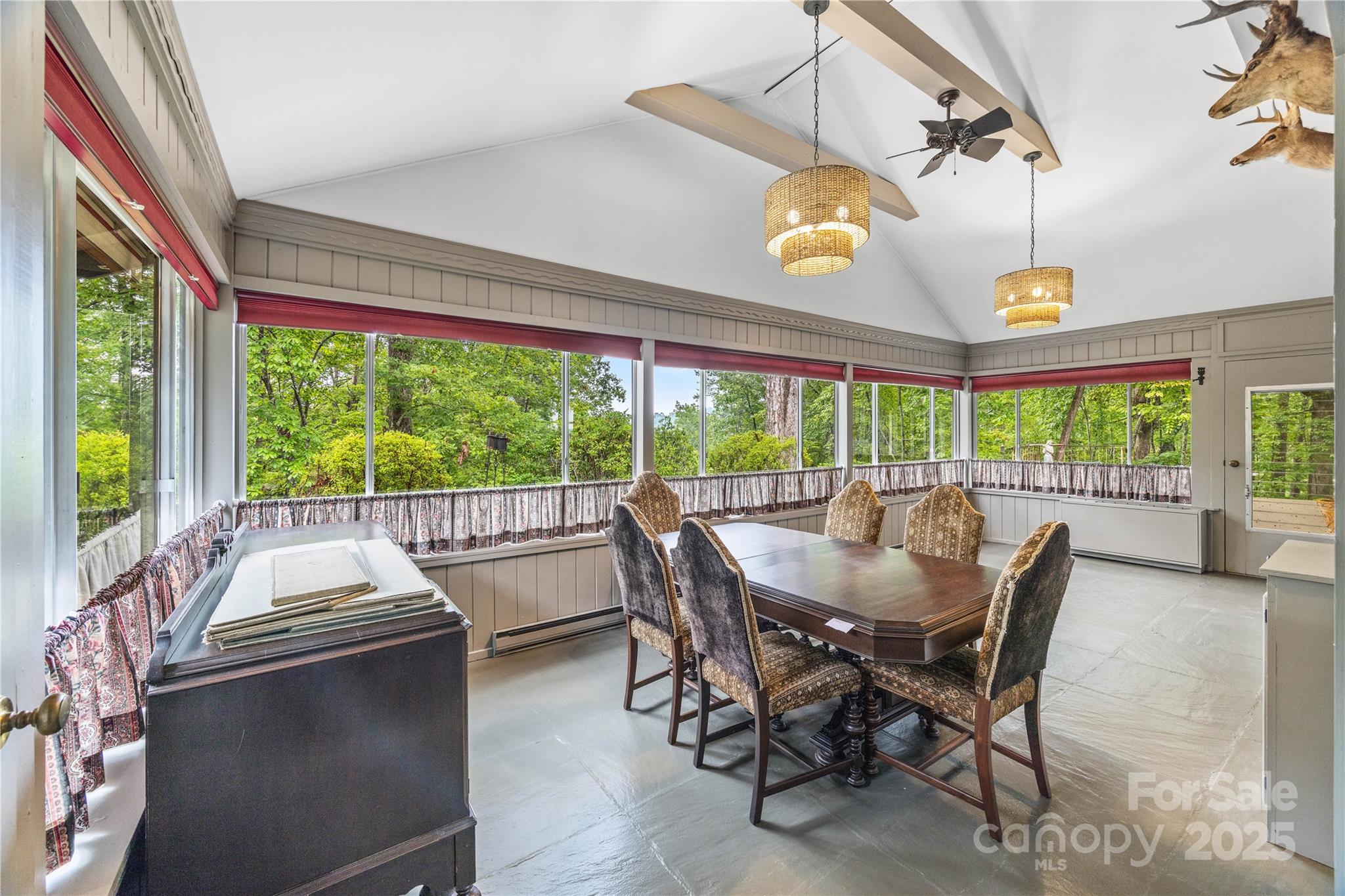 603 Green Hills Road Mill Spring, NC 28756 - Photo 19 of 47 a dining room with furniture a chandelier and a rug