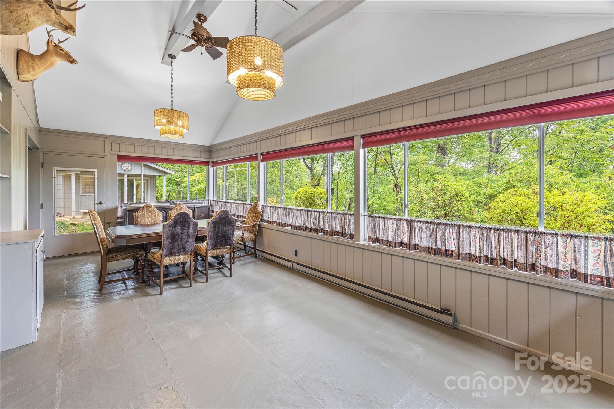 603 Green Hills Road Mill Spring, NC 28756 - Photo 21 of 47 a view of a dining room with furniture window and outside view