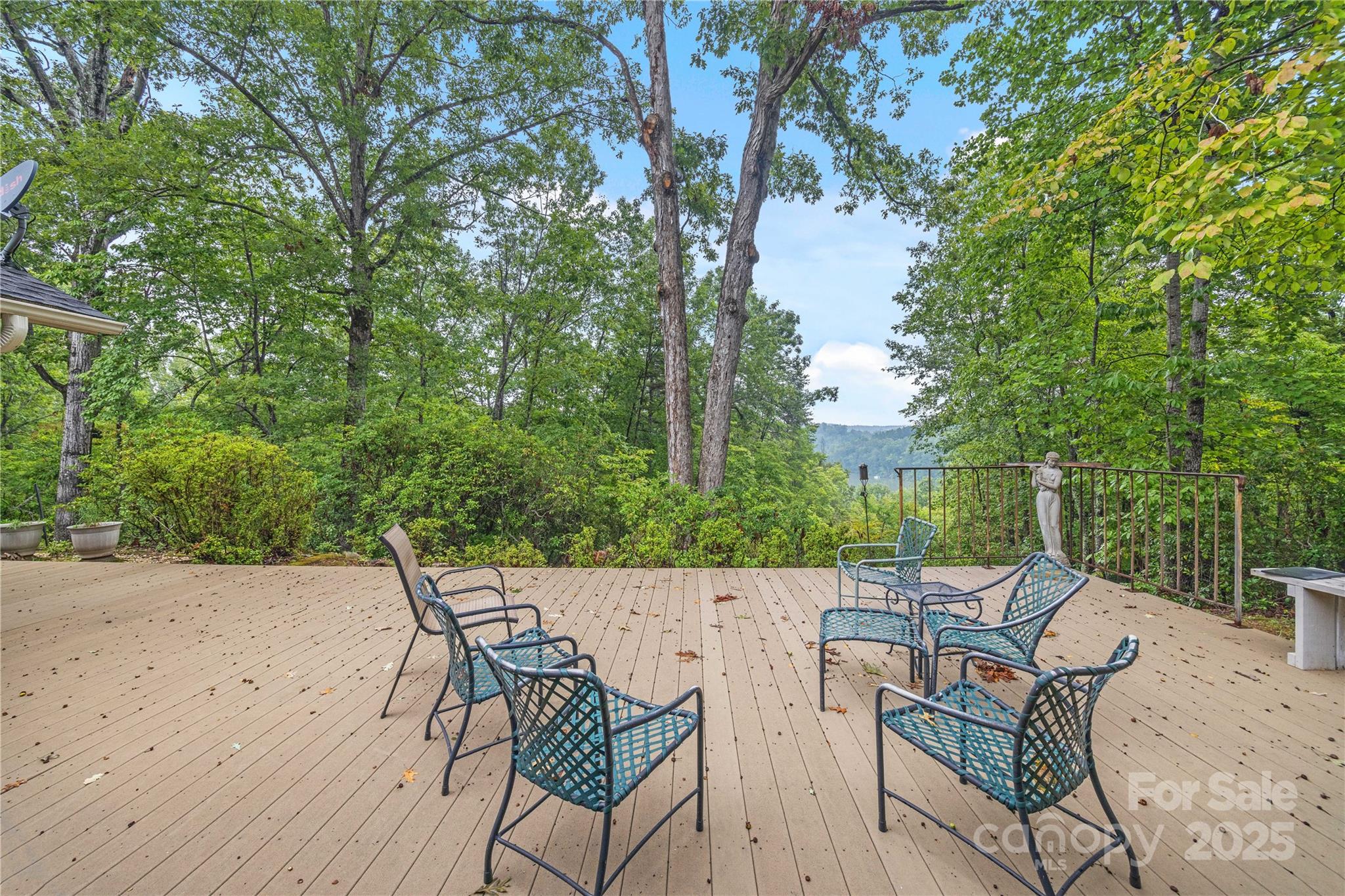 603 Green Hills Road Mill Spring, NC 28756 - Photo 23 of 47 a patio with glass top table and chairs
