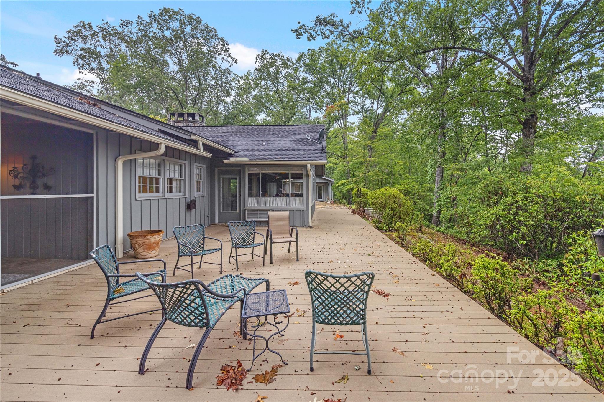 603 Green Hills Road Mill Spring, NC 28756 - Photo 24 of 47 a backyard of a house with table and chairs