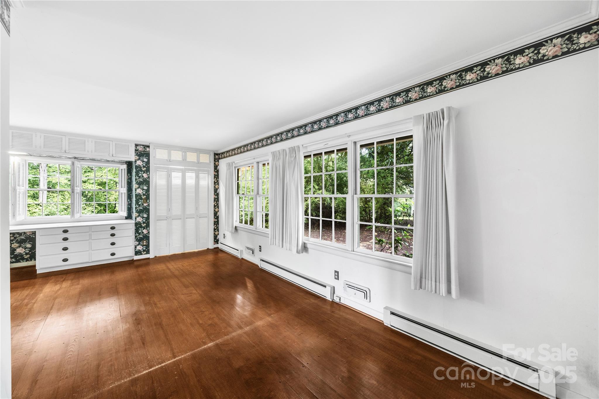 603 Green Hills Road Mill Spring, NC 28756 - Photo 26 of 47 a view of an empty room with a window