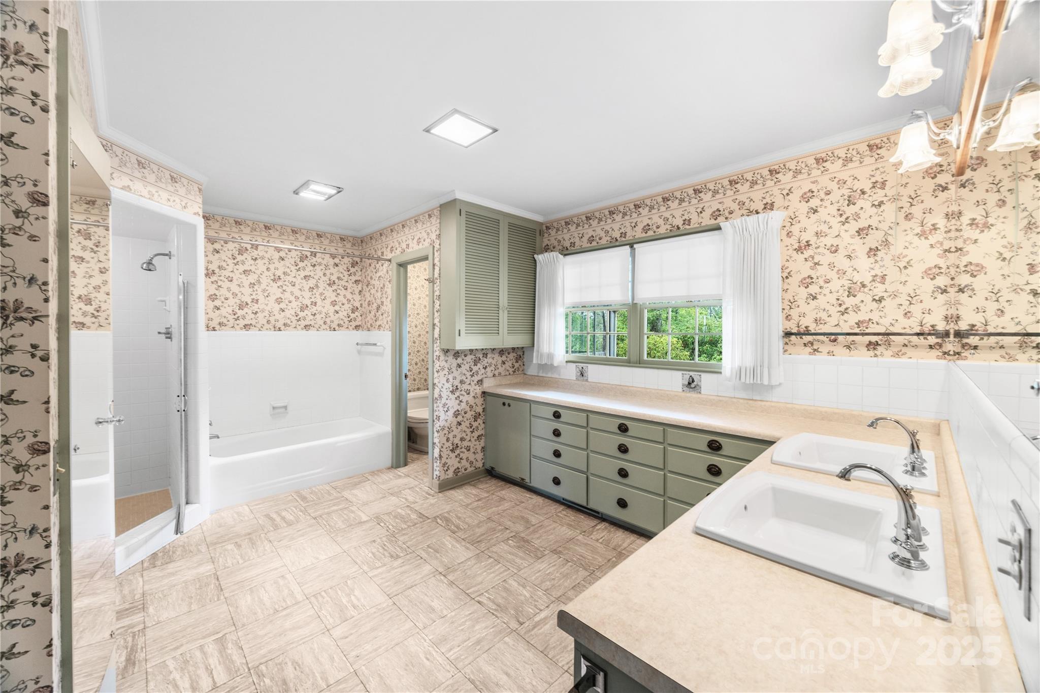 603 Green Hills Road Mill Spring, NC 28756 - Photo 29 of 47 a bathroom with a sink vanity granite tub shower and a large window