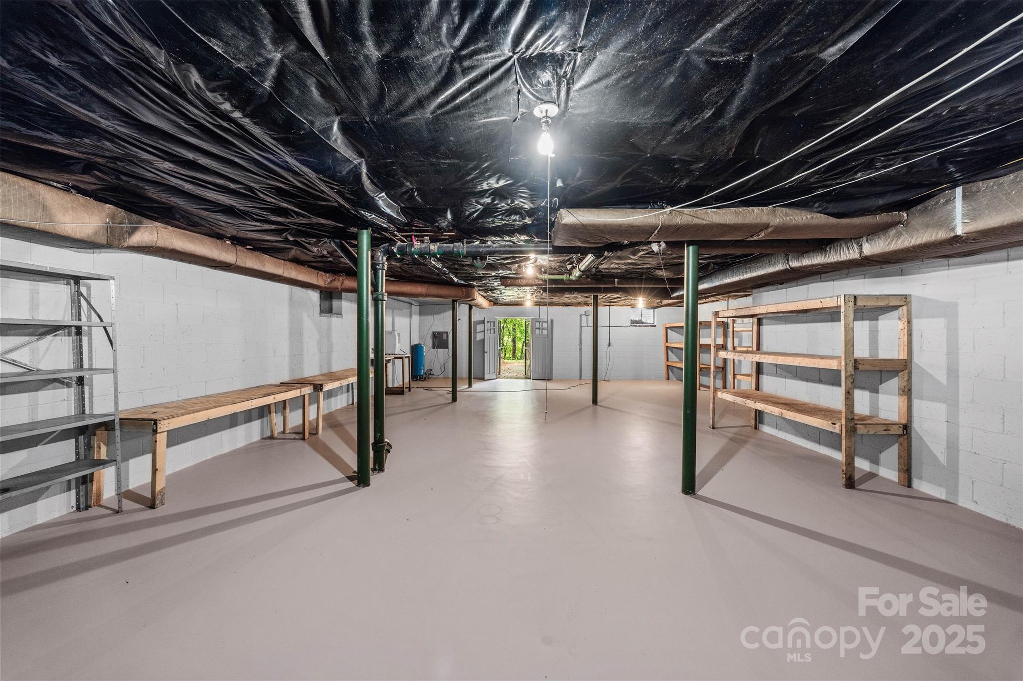 603 Green Hills Road Mill Spring, NC 28756 - Photo 35 of 47 a view of an empty room with wooden roof