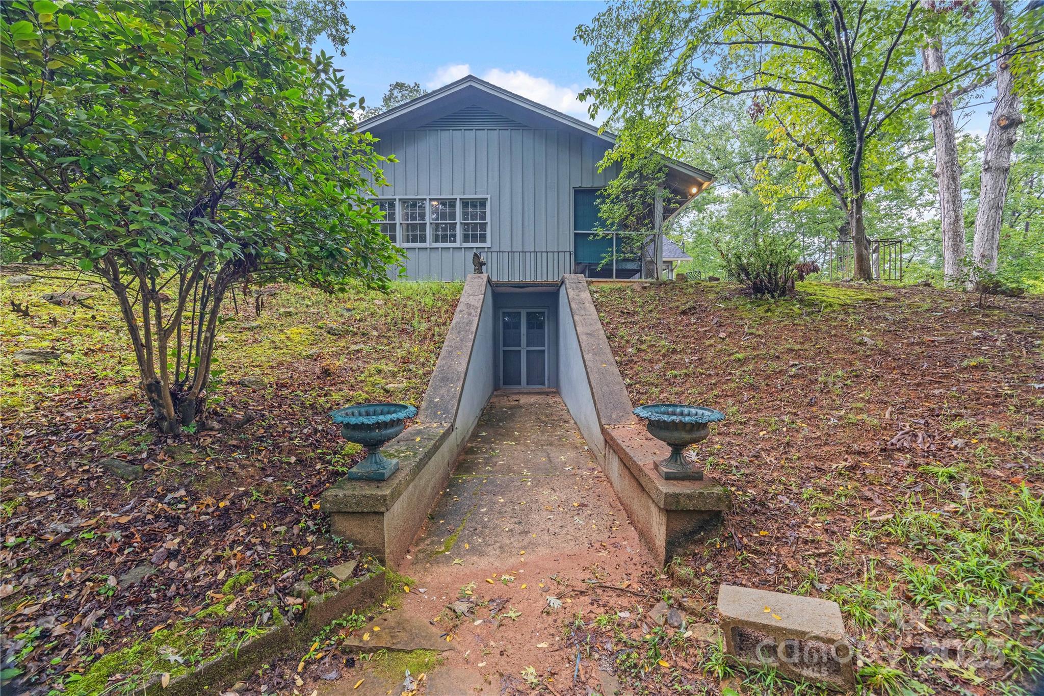 603 Green Hills Road Mill Spring, NC 28756 - Photo 39 of 47 front view of a house with a yard