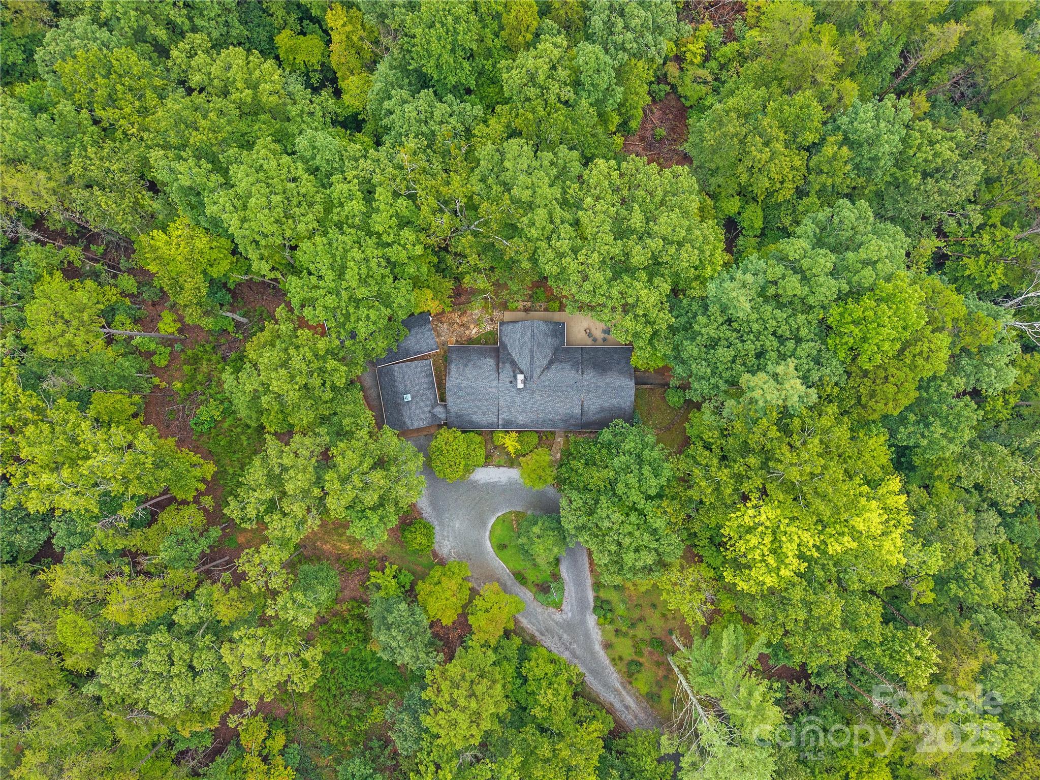 603 Green Hills Road Mill Spring, NC 28756 - Photo 44 of 47 a backyard of a house with table and chairs
