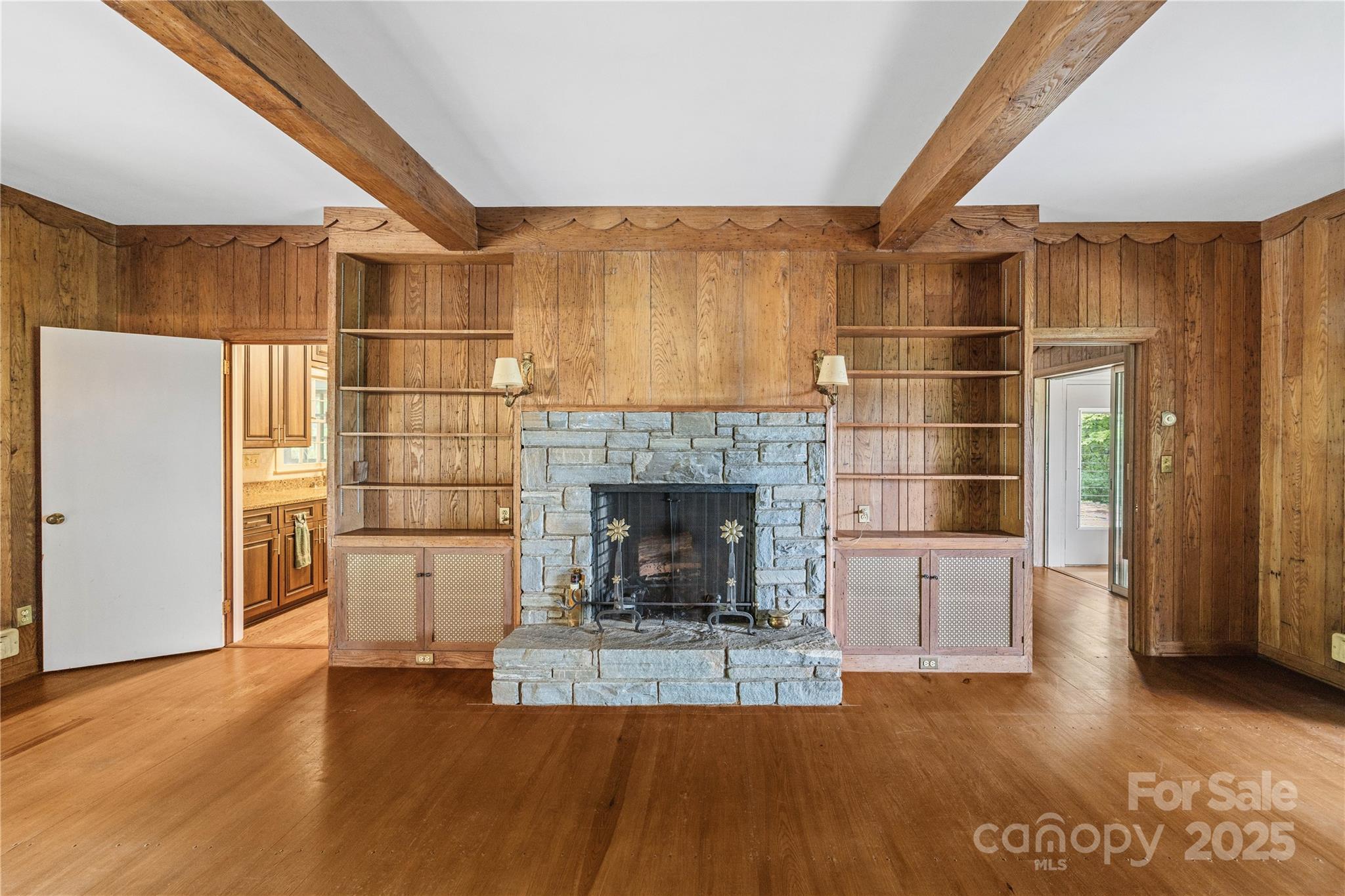 603 Green Hills Road Mill Spring, NC 28756 - Photo 10 of 47 a view of a livingroom with a fireplace and window