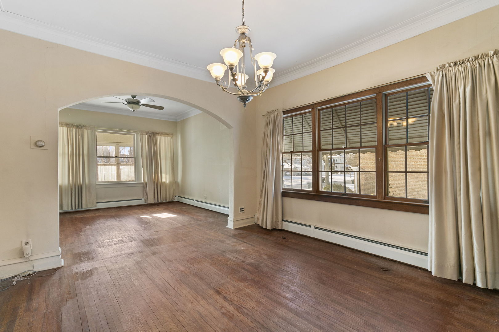 62 Northgate Road Riverside, IL 60546 - Photo 5 of 34 a view of an empty room with wooden floor and a window