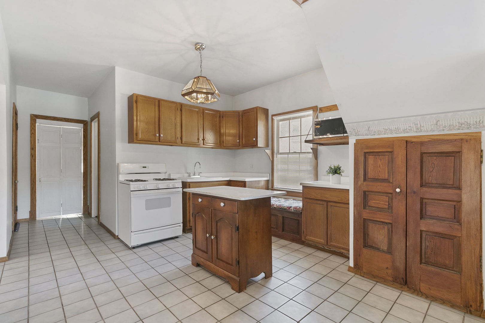 62 Northgate Road Riverside, IL 60546 - Photo 8 of 34 a kitchen with stainless steel appliances granite countertop a stove and a refrigerator