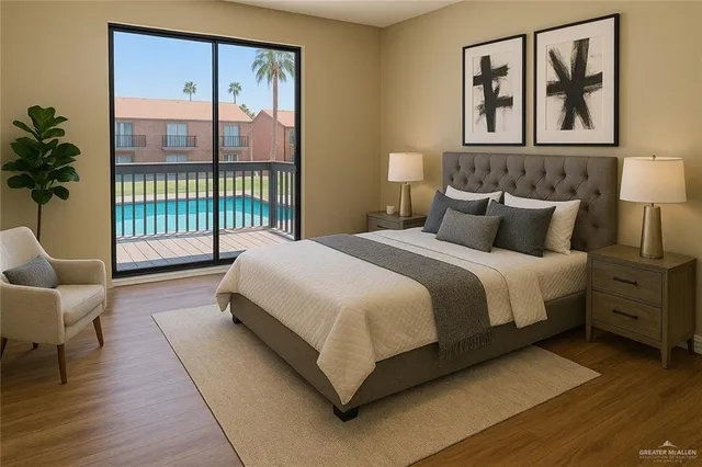 a spacious bedroom with a bed a couch and a window