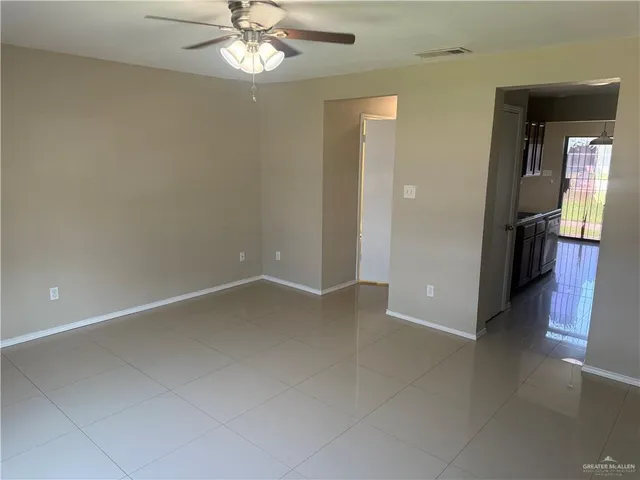 wooden floor in an empty room and a window