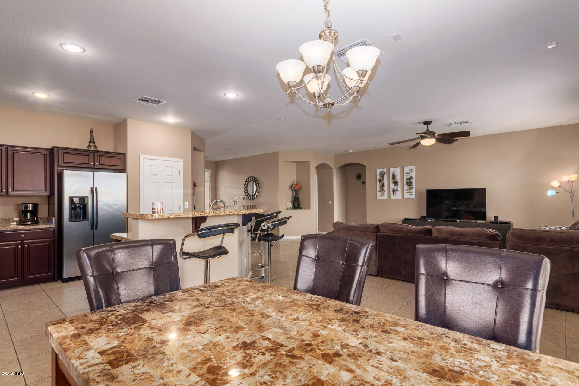 2334 West Beverly Rd. Phoenix, AZ 85041 - Photo 15 of 40 a large kitchen with stainless steel appliances granite countertop a sink stove and refrigerator