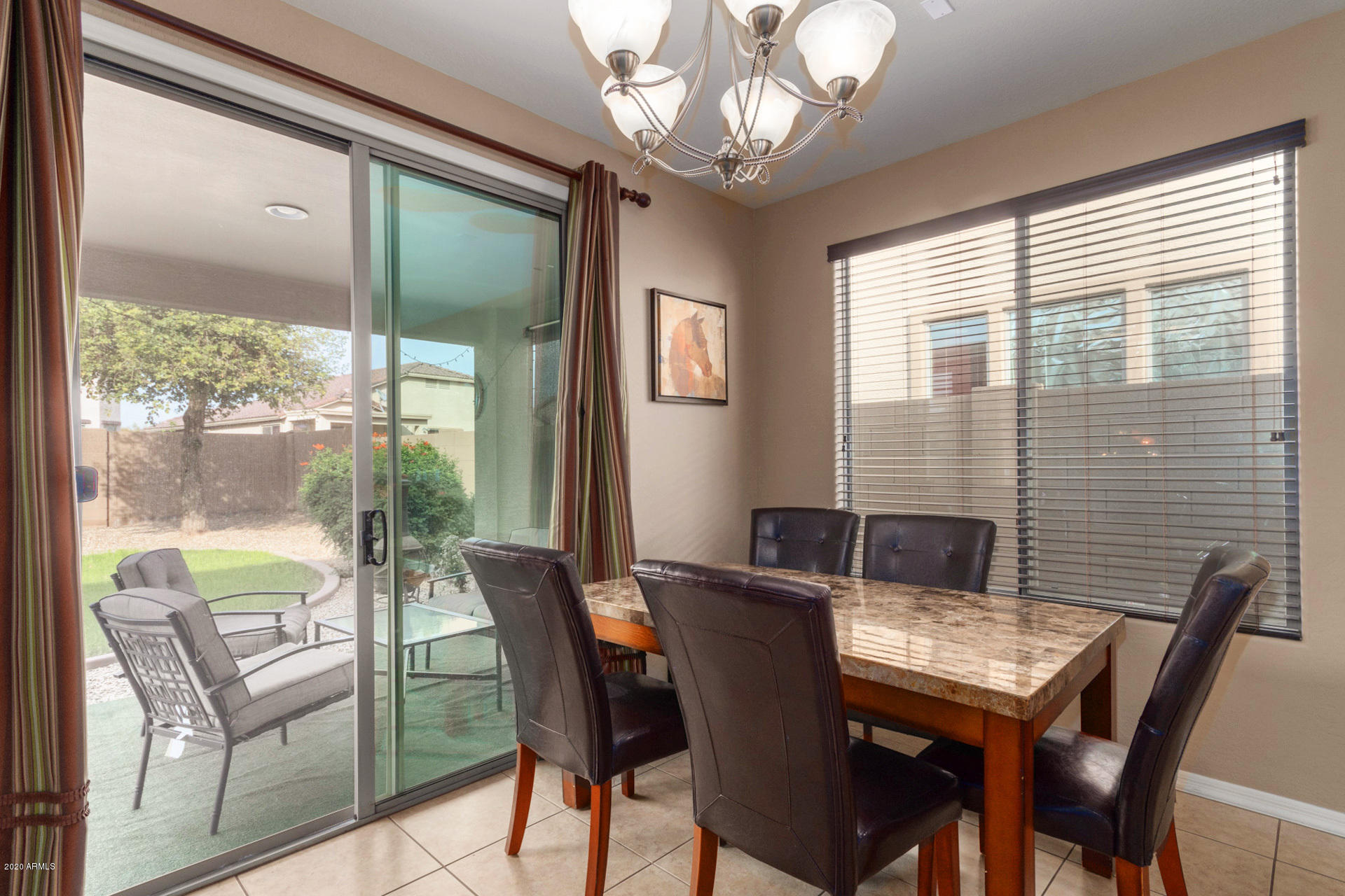 2334 West Beverly Rd. Phoenix, AZ 85041 - Photo 18 of 40 a view of a dining room with furniture window and outside view