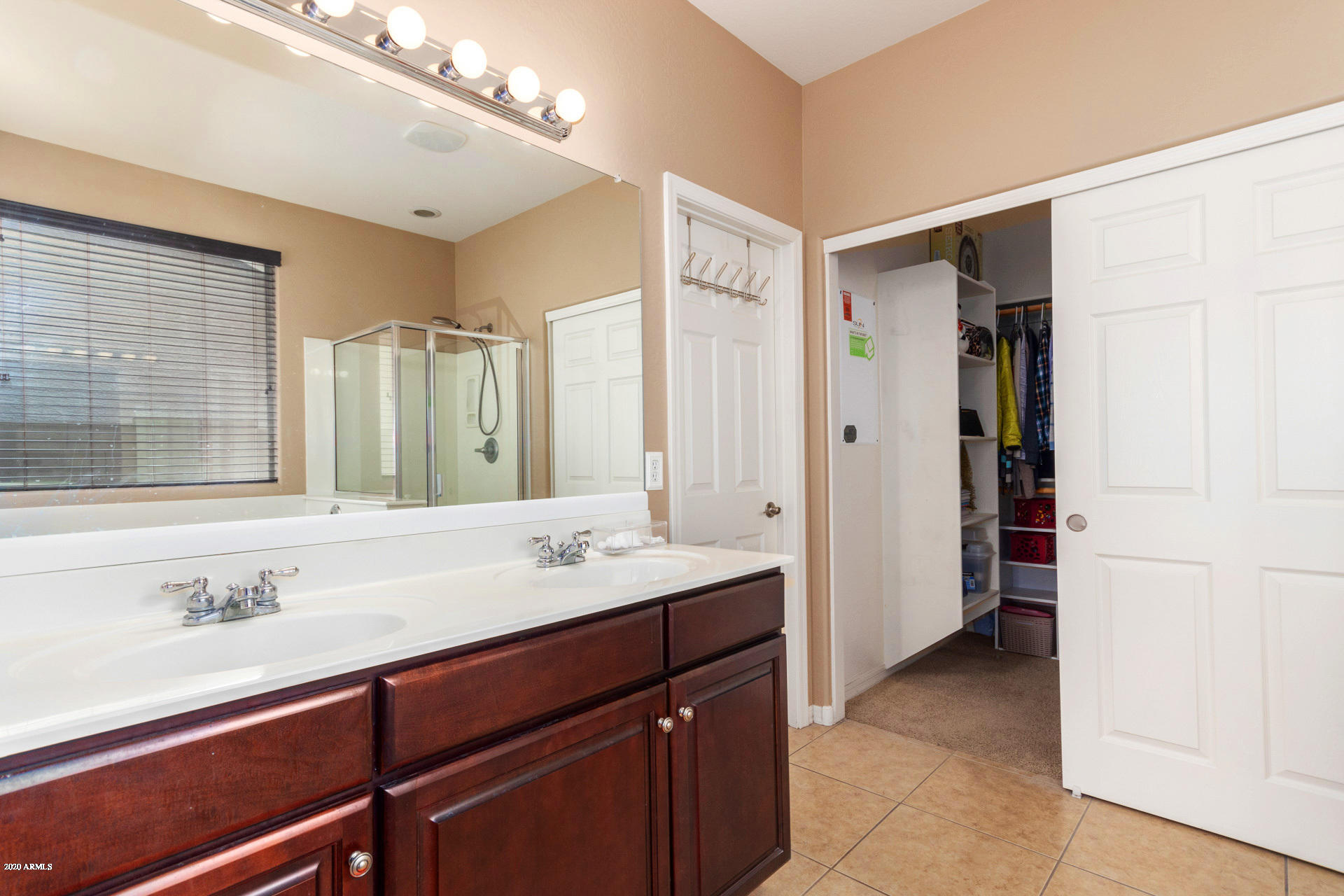 2334 West Beverly Rd. Phoenix, AZ 85041 - Photo 32 of 40 a bathroom with a sink and a mirror