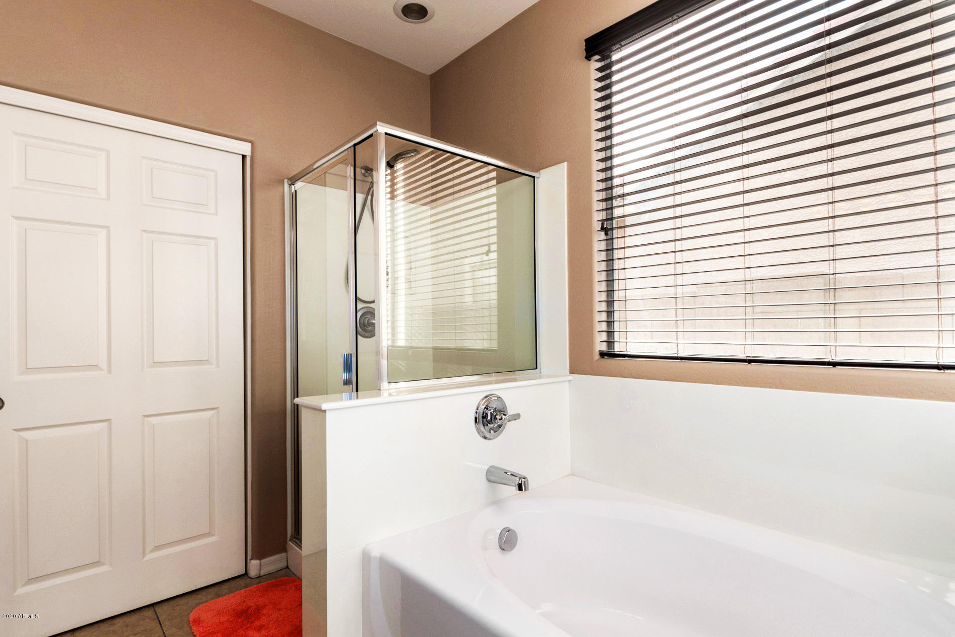 2334 West Beverly Rd. Phoenix, AZ 85041 - Photo 34 of 40 a bathroom with a bathtub and a shower