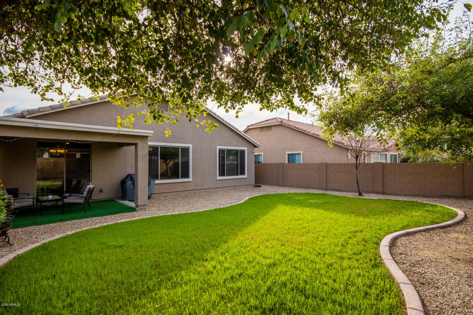 2334 West Beverly Rd. Phoenix, AZ 85041 - Photo 38 of 40 a view of a yard in front of a house