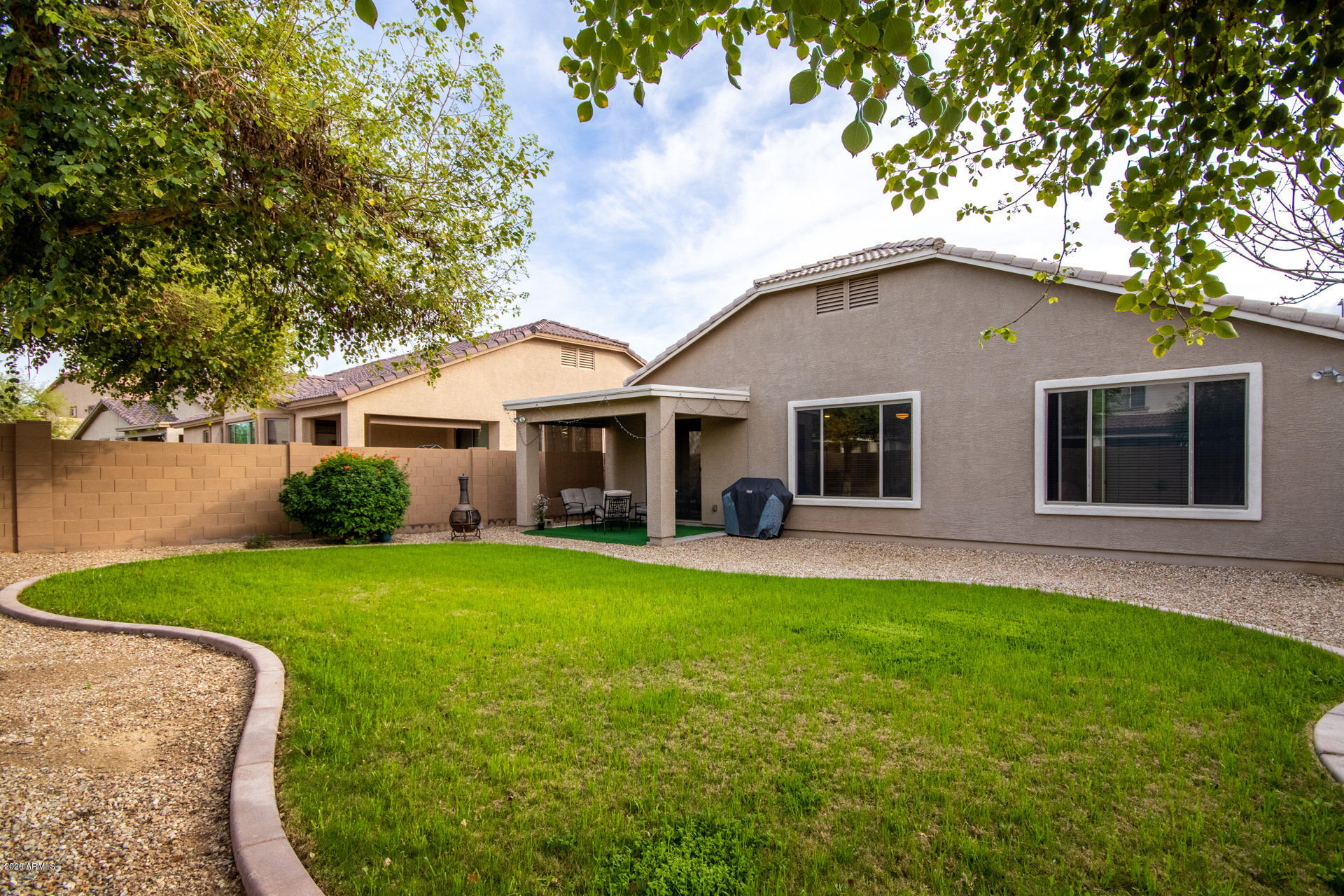 2334 West Beverly Rd. Phoenix, AZ 85041 - Photo 39 of 40 a front view of a house with a garden