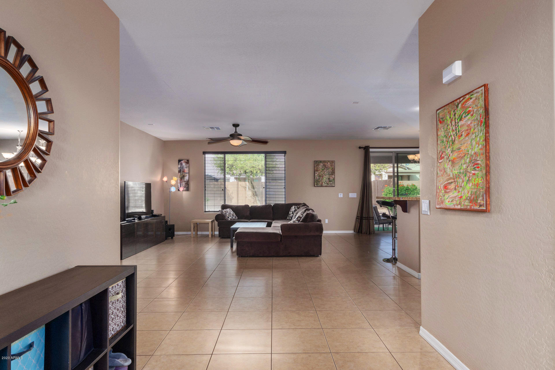 2334 West Beverly Rd. Phoenix, AZ 85041 - Photo 6 of 40 a living room with furniture and a large window