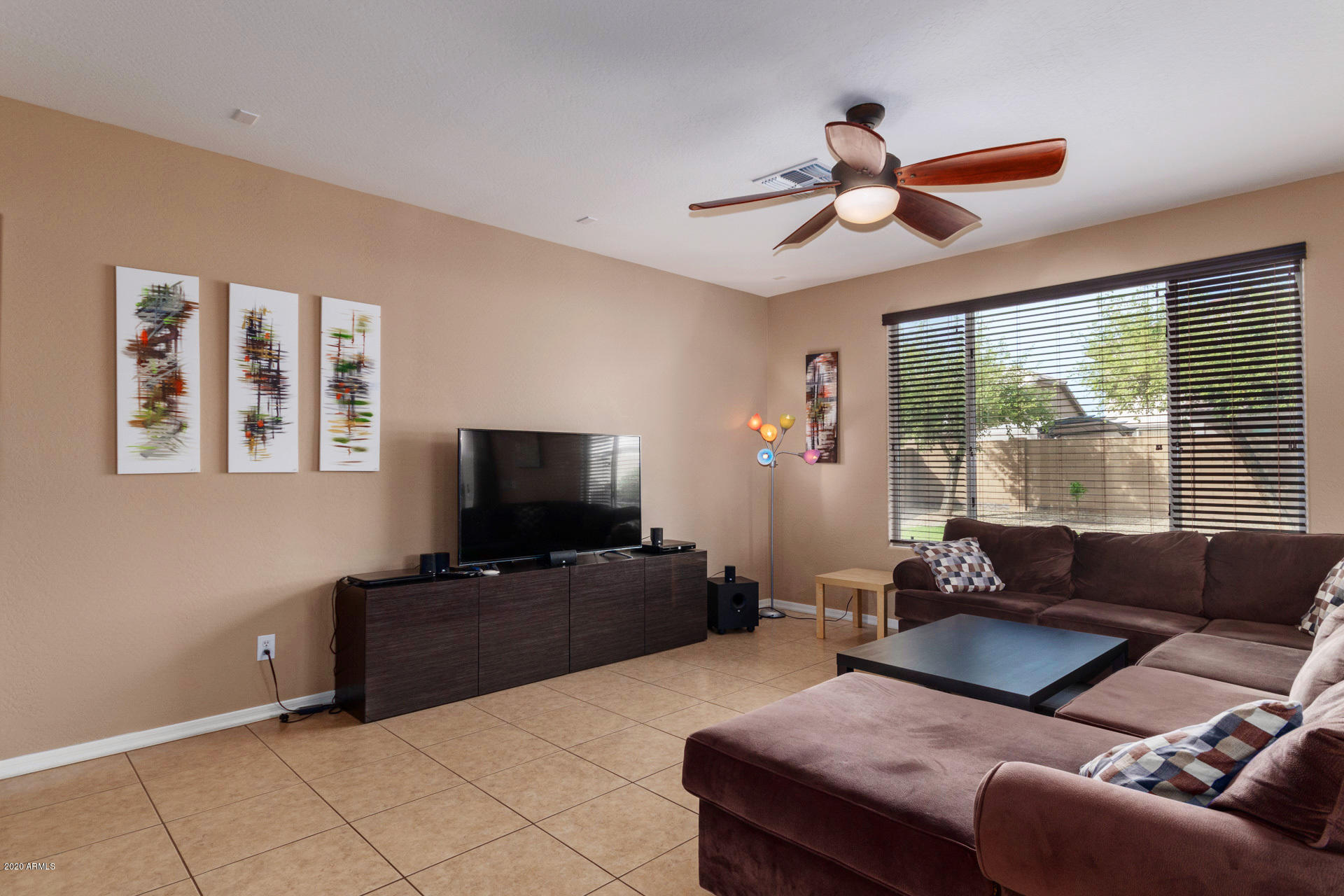 2334 West Beverly Rd. Phoenix, AZ 85041 - Photo 7 of 40 a living room with furniture and a flat screen tv