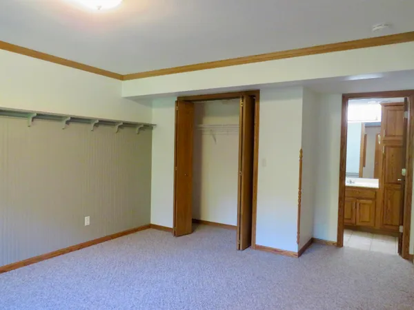 a kitchen with a wooden floor and a fireplace