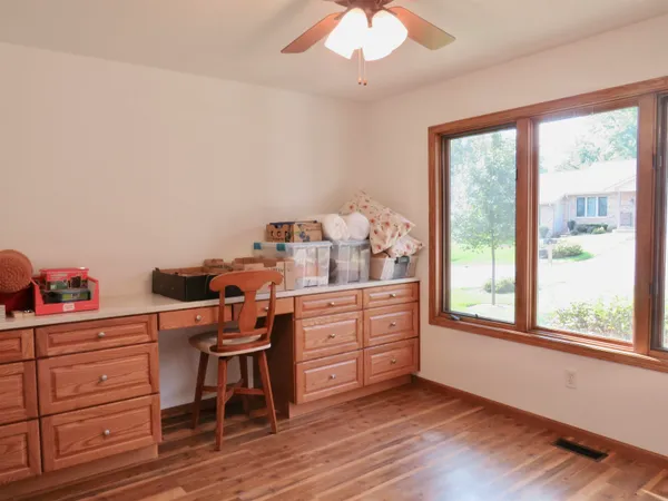 a bathroom with a sink toilet vanity and shower