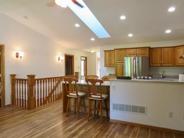 a hallway with sliding door and wooden floor