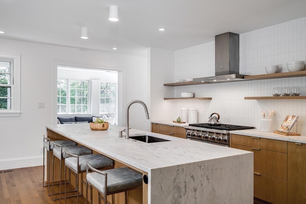 4 Welland Road Brookline, MA 02445 - Photo 5 of 15 a kitchen with a sink a stove and cabinets