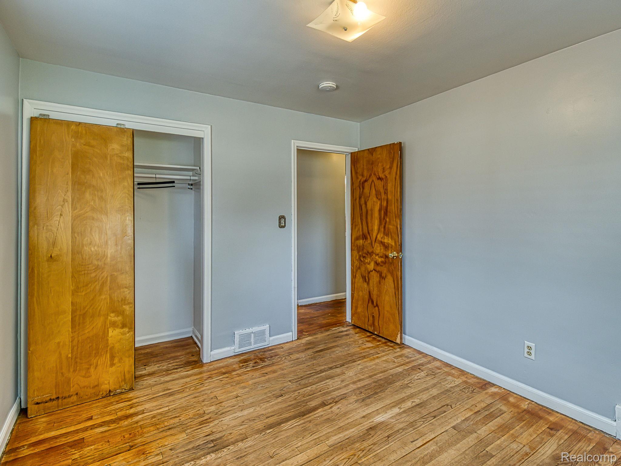 8501 Allen Road Allen Park, MI 48101 - Photo 14 of 27 Unfurnished bedroom featuring light wood finished floors and a closet