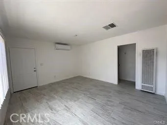 a view of a room with a hallway