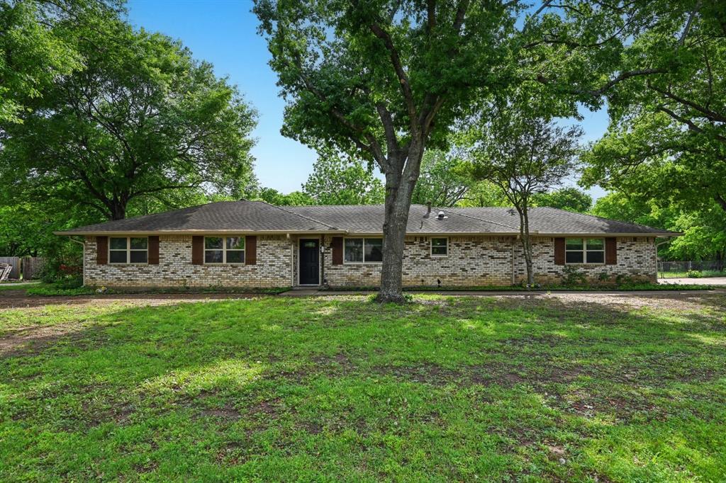 305 South Cockrell Hill Road Ovilla, TX 75154 - Photo 1 of 40 a front view of a house with yard garden and tree