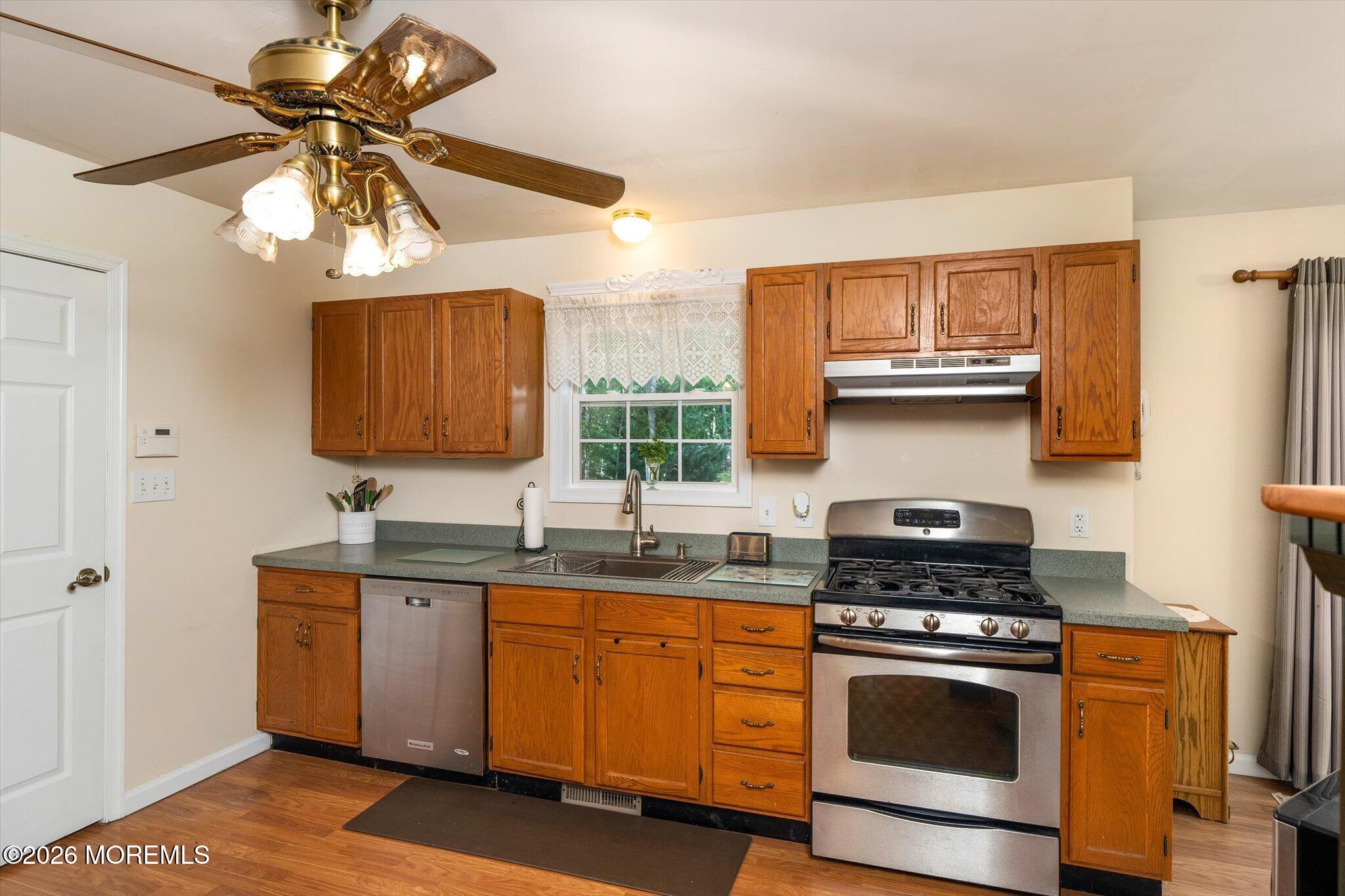 208 North Success Road Cream Ridge, NJ 08514 - Photo 14 of 40 a kitchen with stainless steel appliances a stove a sink and a microwave