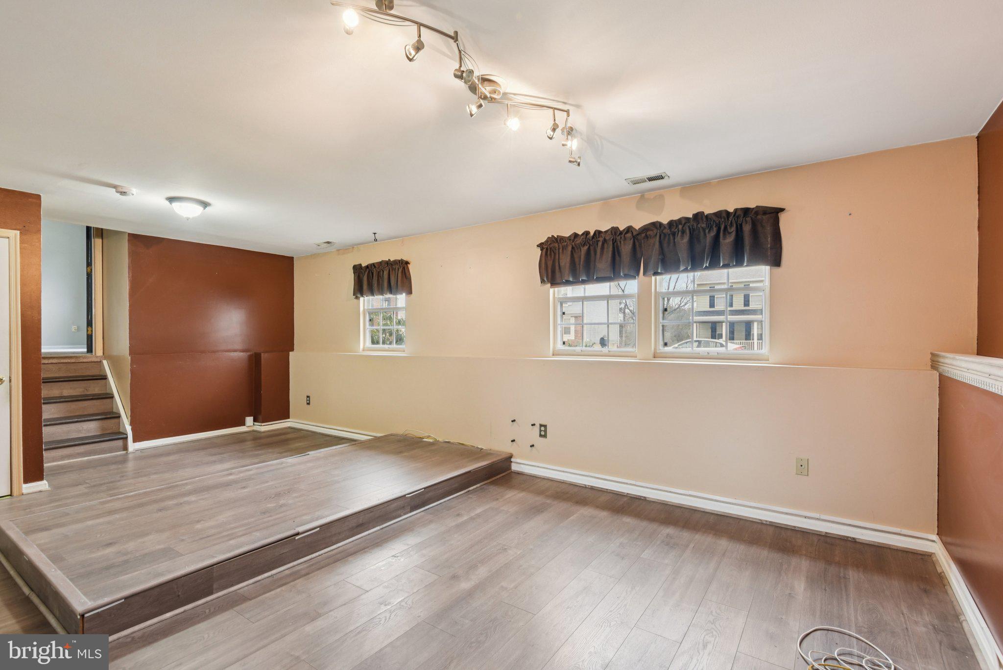 7934 Galloping Circle Windsor Mill, MD 21244 - Photo 16 of 38 a view of an empty room with wooden floor