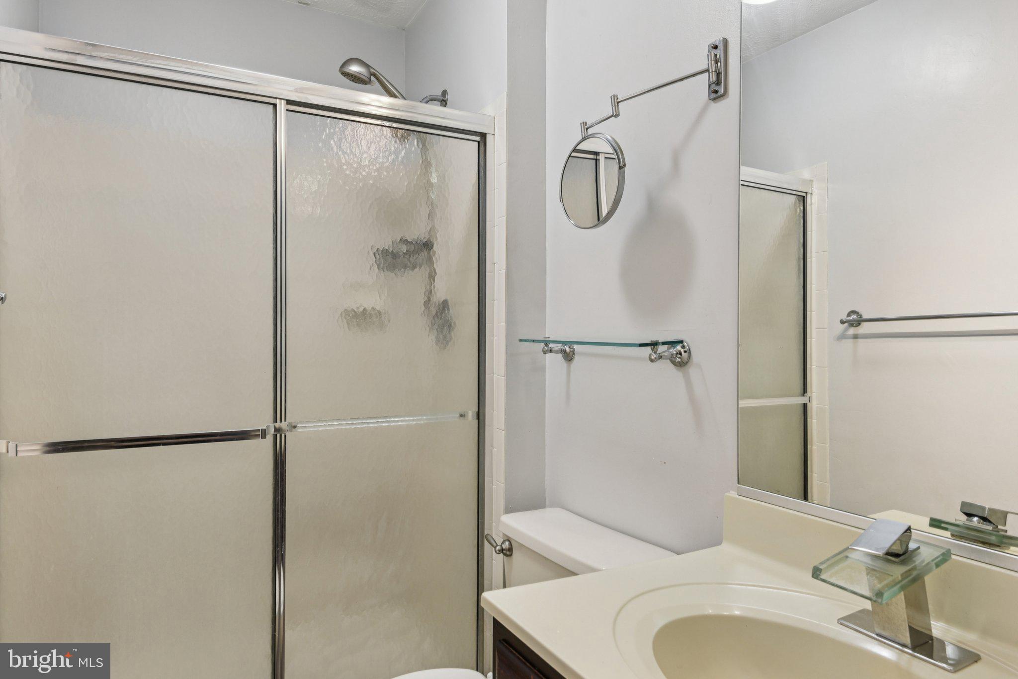 7934 Galloping Circle Windsor Mill, MD 21244 - Photo 25 of 38 a bathroom with a sink toilet and shower