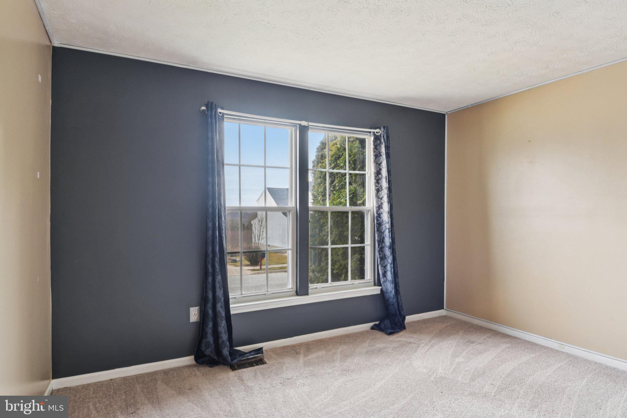 7934 Galloping Circle Windsor Mill, MD 21244 - Photo 28 of 38 an empty room with windows