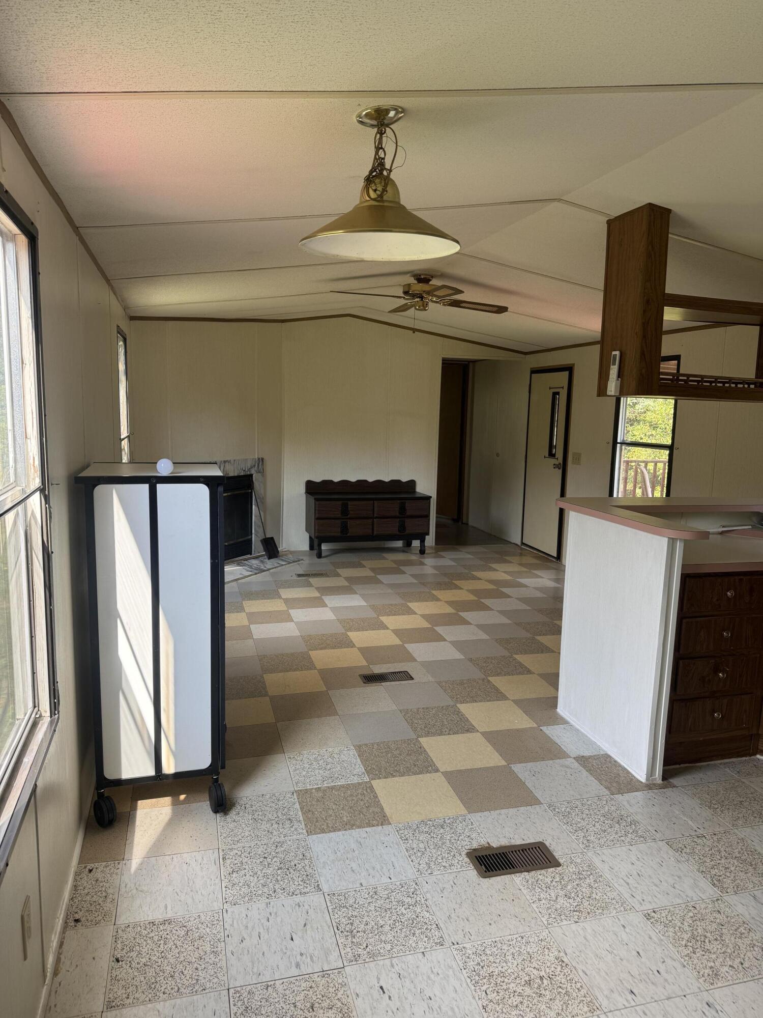 7180 Henry Road Henry, VA 24102 - Photo 7 of 12 a view of a refrigerator in kitchen and an empty room