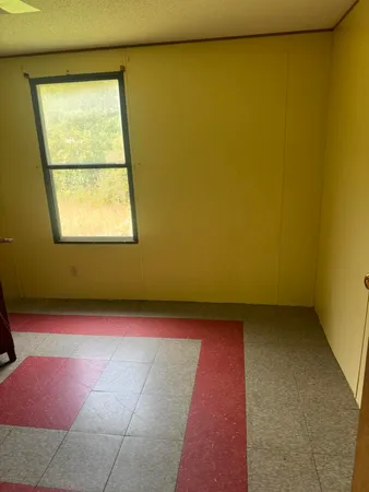 a view of a field with an ocean